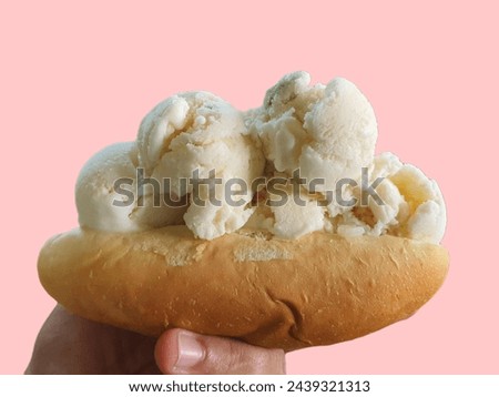 Picture of coconut ice cream with bread in hand