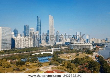 Modern City Skyline with Riverfront Park View