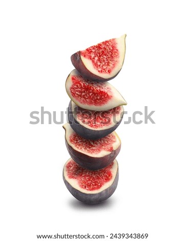Stacked ripe fresh figs on white background