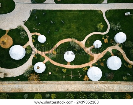 Aerial drone top down view of yuort camp white dome  at culture center of old city Turkestan in South Kazakhstan