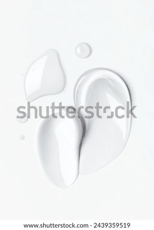 samples of cosmetic care products smear of cream and gel texture on a light background Royalty-Free Stock Photo #2439359519
