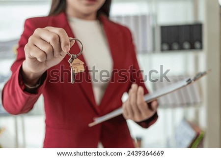 Asian female real estate agent employee recommends house to client Explain home interiors and ultra-interests to customers. Online home selling consultant