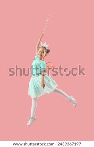 Cute little fairy with wand jumping on pink background