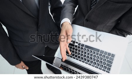 Working on a laptop computer in the office