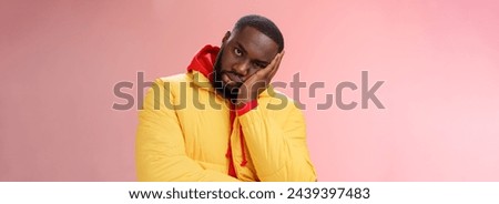 Annoyed bothered pissed african-american bearded man in yellow jacket facepalm look angry camera irritated lean head hand bored fed up pissed hearing uninteresting same stories, pink background. Royalty-Free Stock Photo #2439397483