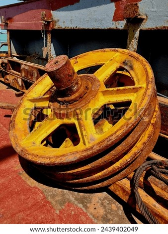 Part of the crane hook block lying on the deck Royalty-Free Stock Photo #2439402049