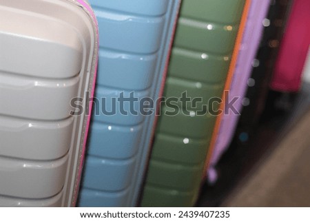 Passengers luggage. Shop. Suitcases in dry goods store. Stock photo. Colorful