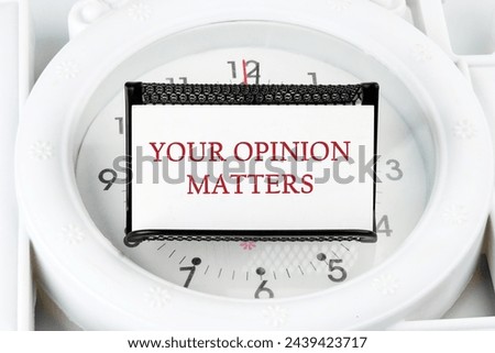 YOUR OPINION MATTERS phrase written on a white business card