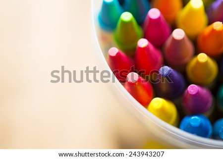 Crayons shot from above with shallow depth of field for dreamy impressional feel .