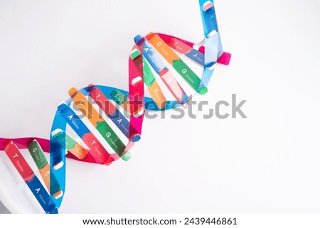 DNA or Deoxyribonucleic acid is a double helix chains structure formed by base pairs attached to a sugar phosphate backbone. Royalty-Free Stock Photo #2439446861