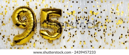 Gold foil balloon number, digit ninety-five. Birthday greeting card with inscription 95. Anniversary celebration. Banner. Golden numeral, white background. Numerical digit. Copy space