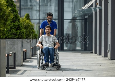 Brunette male nurse rolling a wheelchair with a patient