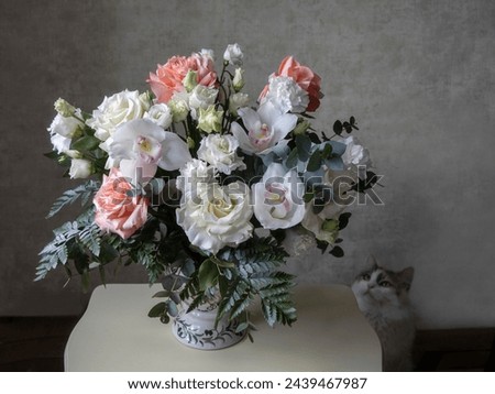 Beautiful bouquet of flowers and curious cat