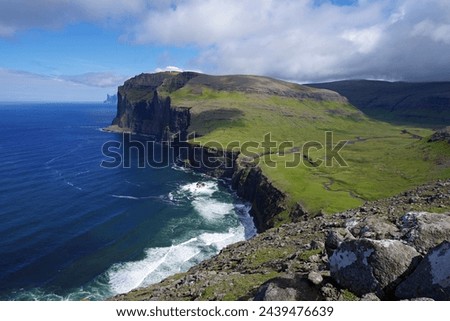 This stunningly beautiful, remote, unspoiled landscape is the north coast of Vagar, Faroe Islands in the north Atlantic Royalty-Free Stock Photo #2439476639