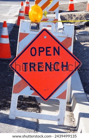 OPEN TRENCH warning road sign	