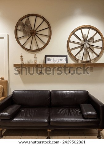 A seating area with rustic, farmhouse decor. Royalty-Free Stock Photo #2439502861