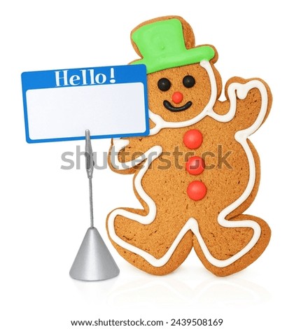Gingerbread man with a blank card on a stand.