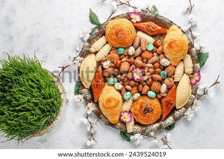 Traditional Azerbaijan holiday Novruz background with green semeni.