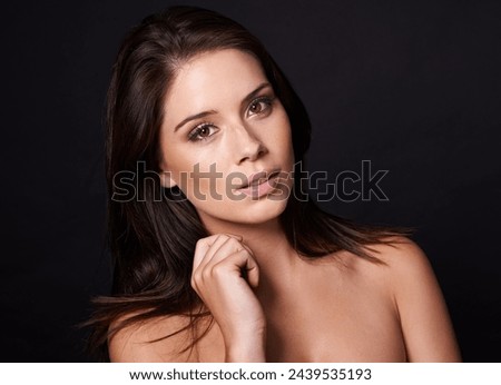Beauty, portrait and woman in studio for makeup, wellness or cosmetic shine on black background. Face, calm or female model with glowing skin, attitude or natural results from dermatology treatment Royalty-Free Stock Photo #2439535193