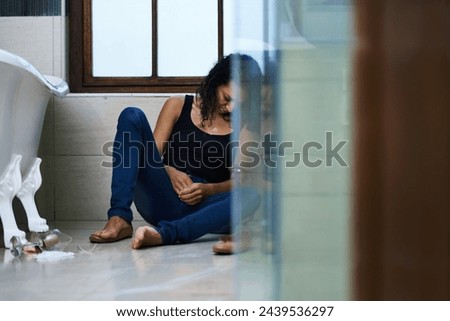Woman, drug addict and sleep in bathroom for addiction or withdrawal symptoms, depression and mental health. Person or user, overdose and glass of alcoholic for substance abuse for feeling of stress. Royalty-Free Stock Photo #2439536297
