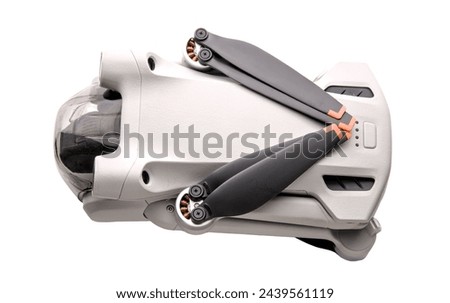 drone folded up (small recreational aircraft quad copter that shoots 4k video) isolated on white background (close up, macro, cut out) Royalty-Free Stock Photo #2439561119