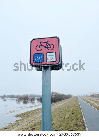 Sign marking the beginning of a bicycle path in Europe, bicycle path funded by the European Union, cycling culture, bicycle road marking EU-funded bike lane Bike lane symbol, European bike route cycle