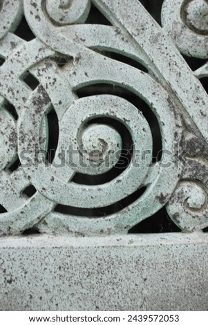An interesting vintage copper gate detail with a spiral swirl.