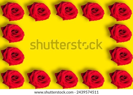 Seamless pattern of red roses on bright yellow background. Copy space for the text