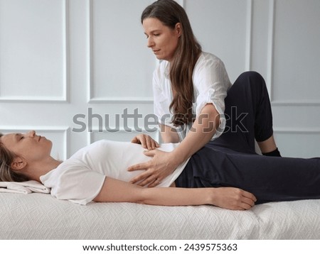 Somatic therapy, Therapeutic touch concept. Nervous system Regulation Royalty-Free Stock Photo #2439575363
