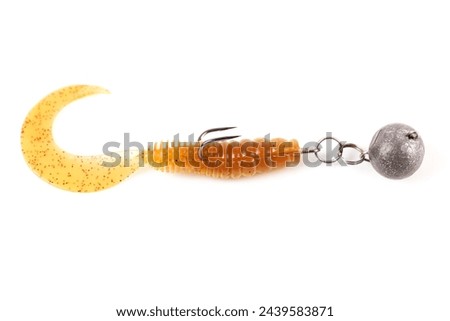 Soft fishing bait, silicone grub, with double hook and lead sinker, isolated on white background Royalty-Free Stock Photo #2439583871