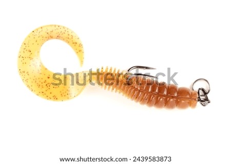 Yellow silicone grub, fishing lure with double hook, isolated on white background Royalty-Free Stock Photo #2439583873