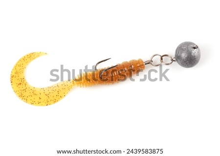 Soft fishing bait, silicone grub, with double hook and lead sinker, isolated on white background