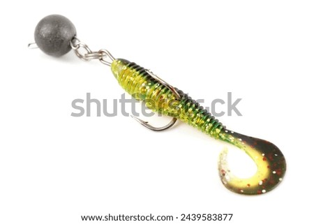 Soft fishing bait, moss green plastic grub, with double hook and lead sinker, isolated on white background Royalty-Free Stock Photo #2439583877