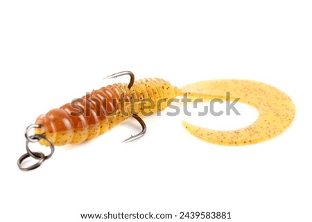 Yellow silicone grub, fishing lure with double hook, isolated on white background Royalty-Free Stock Photo #2439583881