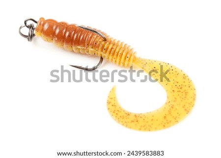 Yellow silicone grub, fishing lure with double hook, isolated on white background Royalty-Free Stock Photo #2439583883