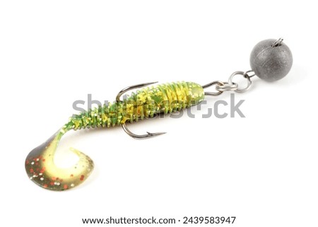 Soft fishing bait for predatory fish, moss green plastic grub, with double hook and lead sinker, isolated on white background Royalty-Free Stock Photo #2439583947