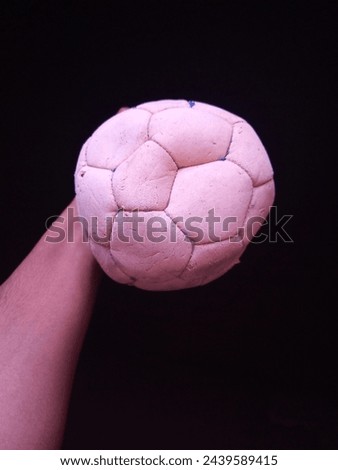 A close-up picture of the condition of a small ball after a long period of use