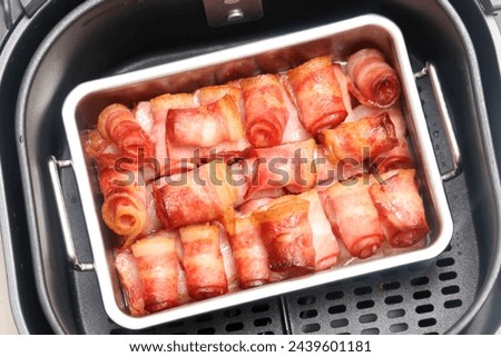 bacon roll fried in air fryer Royalty-Free Stock Photo #2439601181
