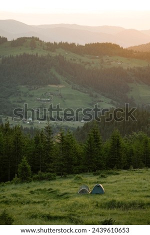 Magical dawn in the Carpathians, in the foreground a road for tourists, fabulous dawns in the mountains.