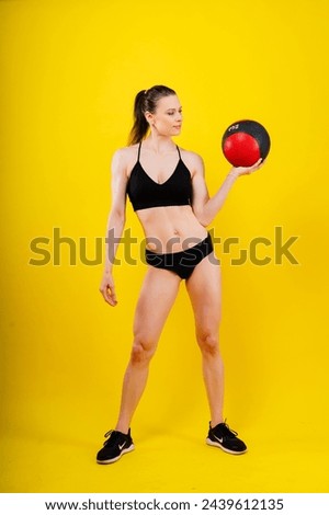 Strong woman does exercise with med ball slams. Strength and motivation.