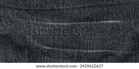 Jeans fabric texture. High quality stock photo. The connection of the fibers of the fabric.