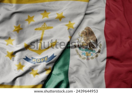 big waving realistic national colorful flag of rhode island state and national flag of mexico . macro