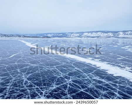 Winter landscape with mountains and Lake Baikal in Siberia. Natural background. Great backdrop for your design with copy space. Aerial view.