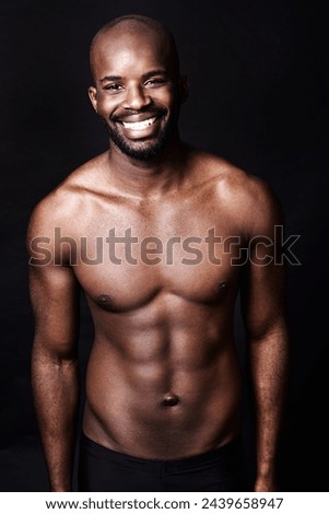 Black man, shirtless and body with smile in portrait, fitness and health with muscle or abs on dark background. Exercise, sport and athlete with six pack, confident and masculine with testosterone