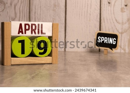 April 19th. Image of april 19 wooden color calendar on white background. Spring day, empty space for text. The Day Of Snowdrop