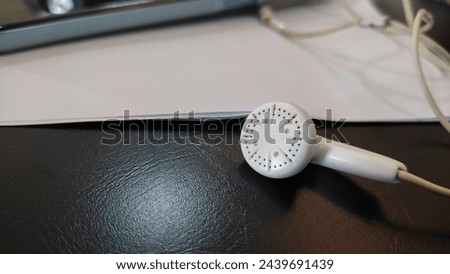 white headset located on a black background