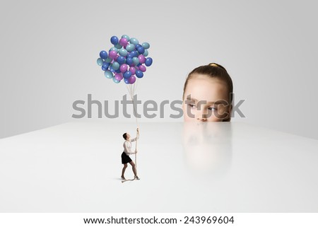 Little cute girl and woman with bunch of colorful balloons