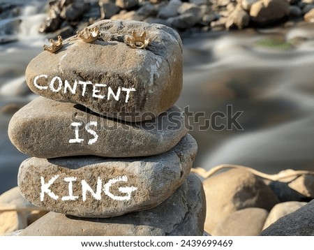 Inspirational Quote - content is king written on stack rocks background. Stock photo.