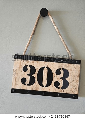 this is board sign in hotel with the number 