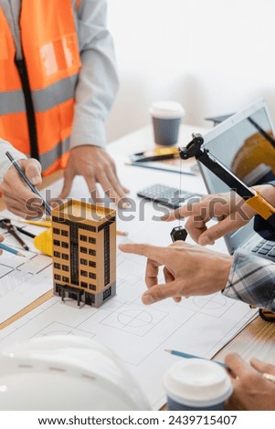 Engineering team at the meeting Construction concept of meeting engineer or architect for project working with partners and engineering tools in modeling and blueprint design in office